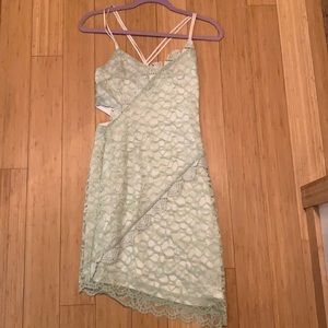 Topshop green and white lace spaghetti strap dress with cutout on side. Size 4